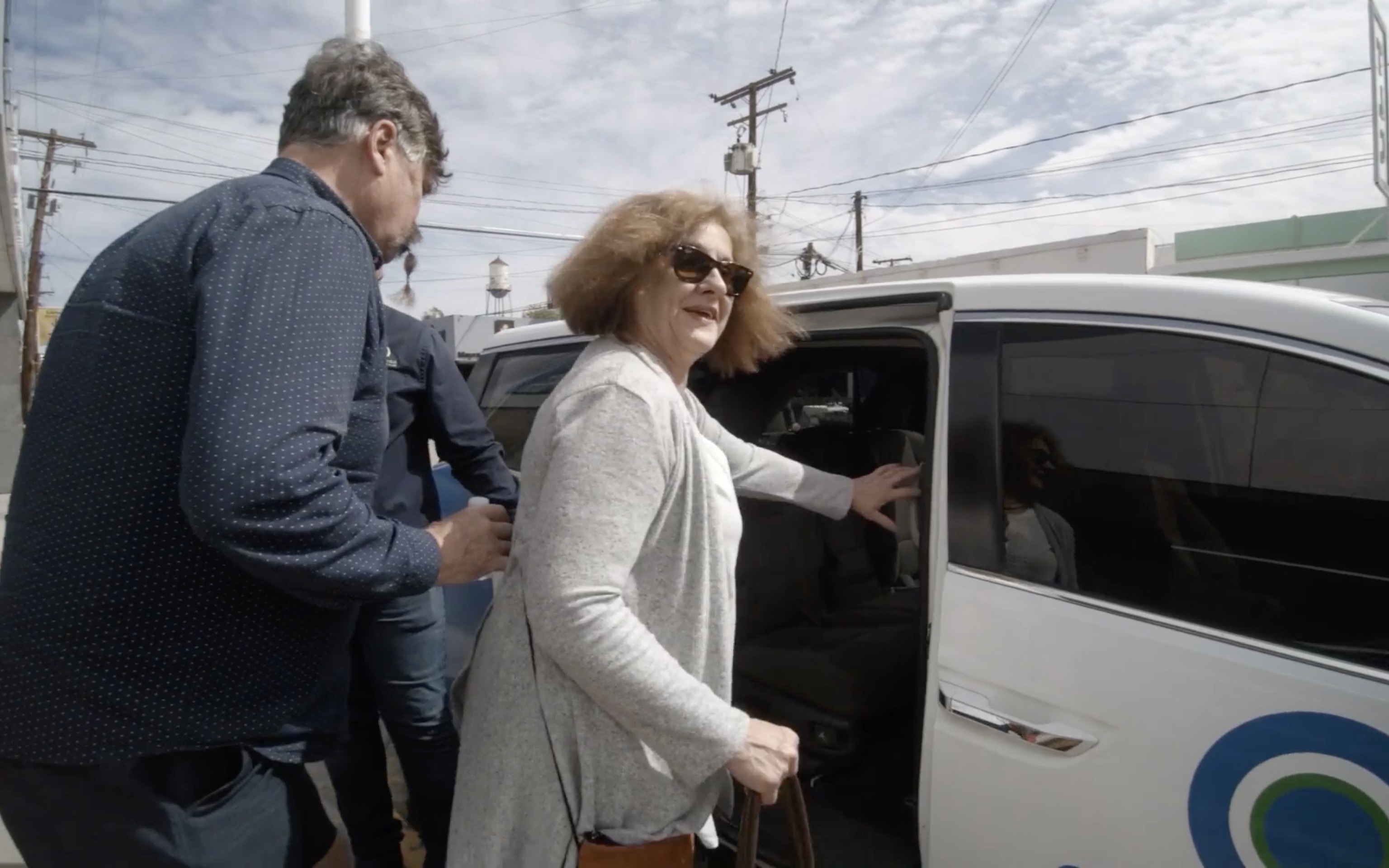 A patient boarding the Circle Dental Group free shuttle van
